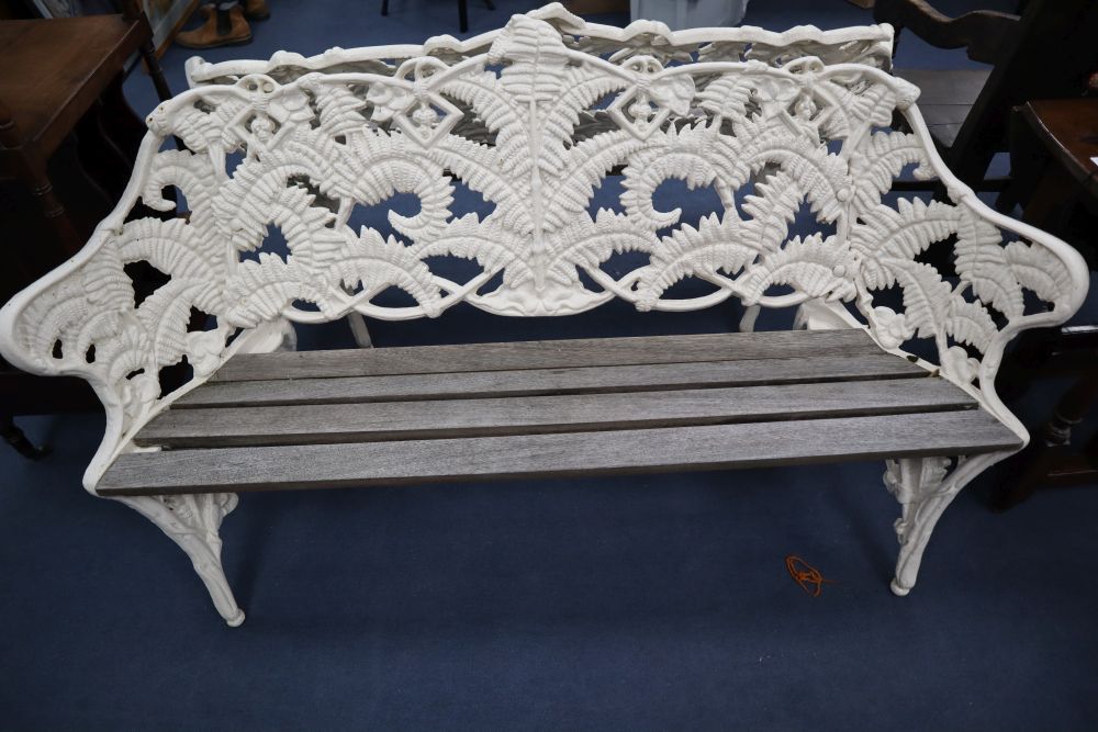 A pair of Coalbrookdale style cast iron garden benches, in fern pattern, with teak slats, width 151cm, depth 26cm